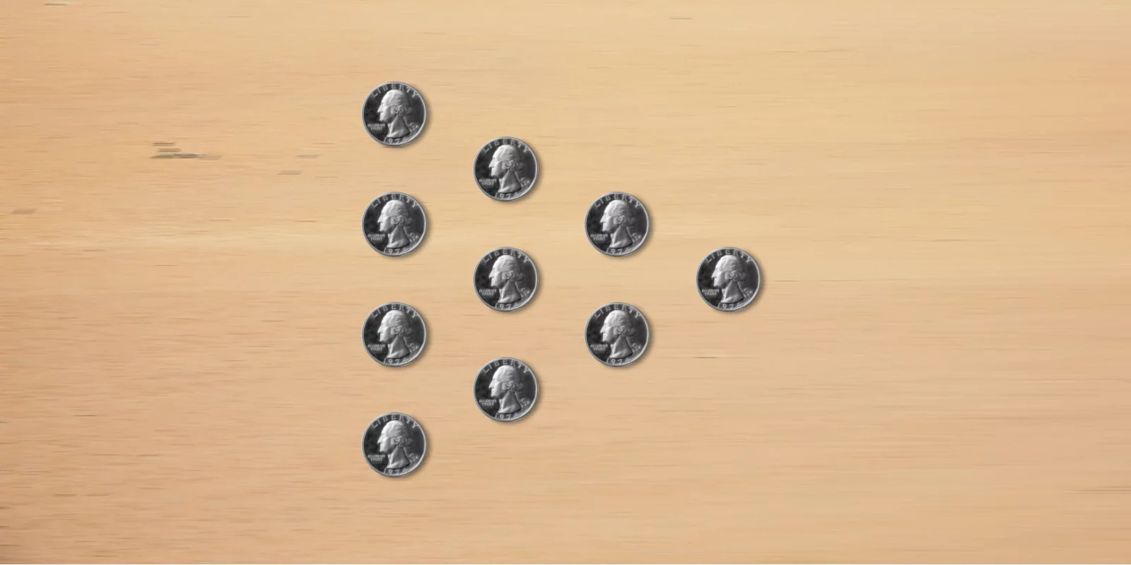 10 coins laid in a pyramid, with the tip to the right.