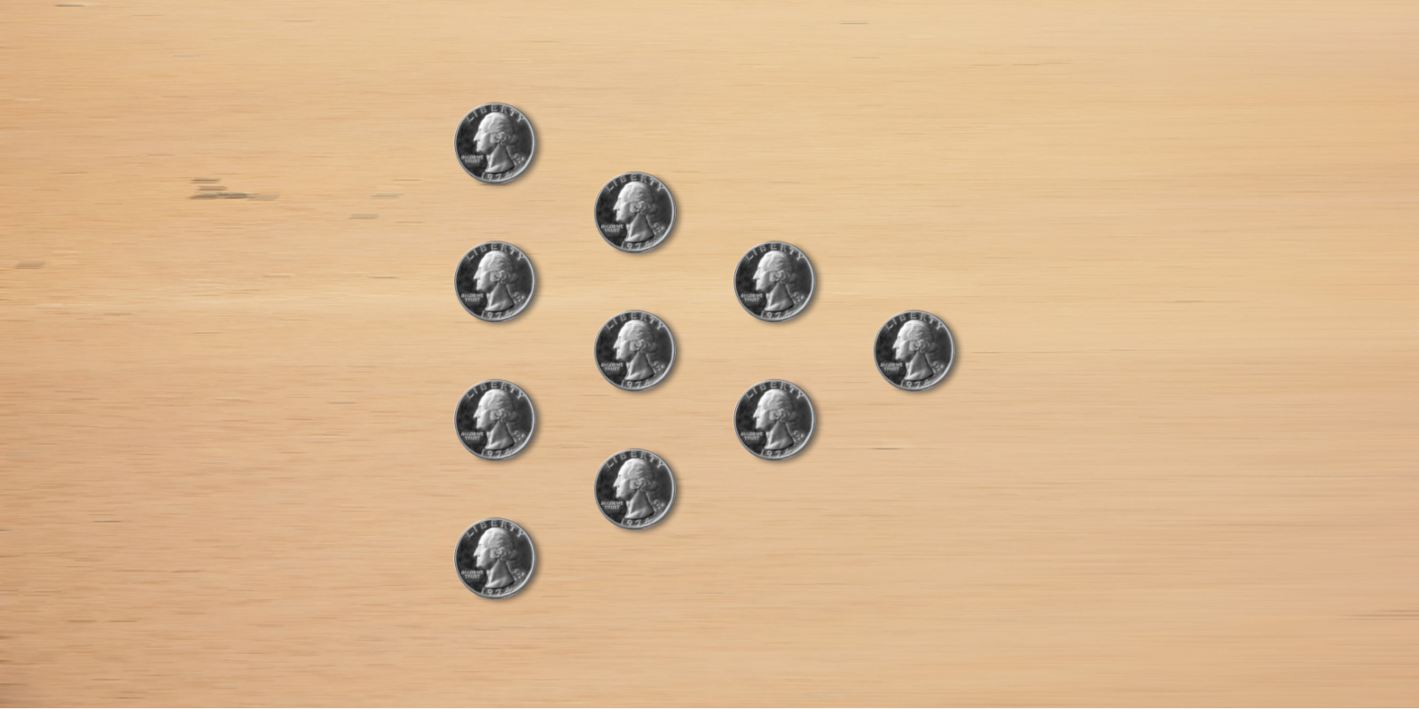 10 coins laid in a pyramid, with the tip to the right.