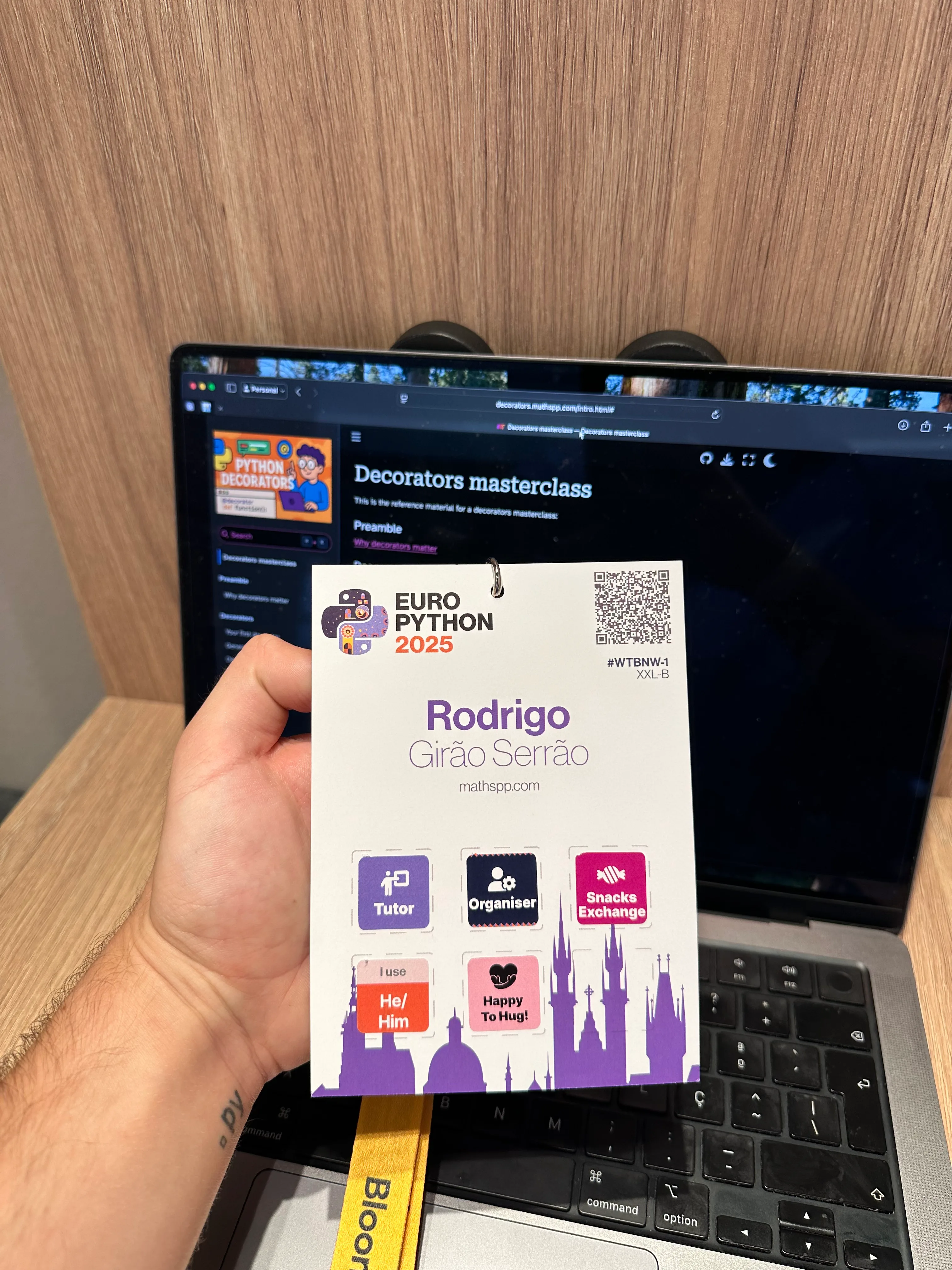 A picture of my EuroPython 2025 badge. In it, you can read my name (Rodrigo Girão Serrão) and affiliation (mathspp.com), but custom stickers provide further information, like my pronouns (he/him), the fact that I'm happy to hug friends, the fact that I have a tutorial, I'm an EuroPython organiser, and I'm participating in the snacks exchange.