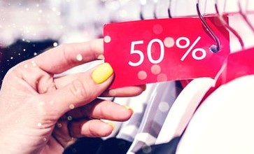 A picture of a "50% off" tag, cropped from an original by Artem Beliaikin on Unsplash.